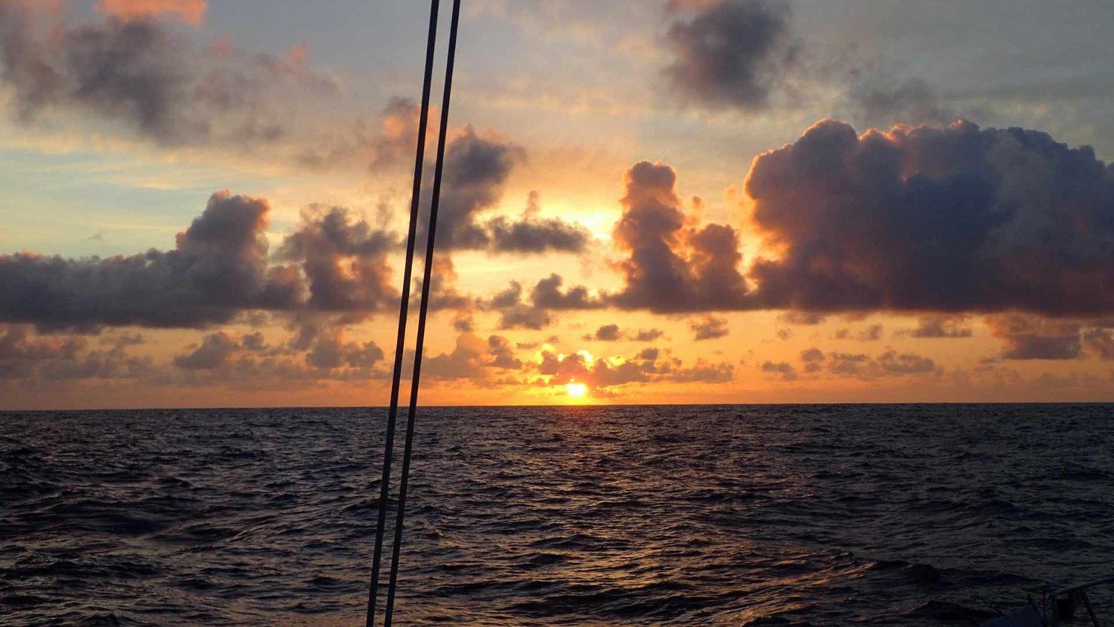 Sailing yacht at sea at sunset
