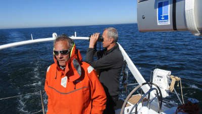 Crew keeping lookout during a yacht delivery